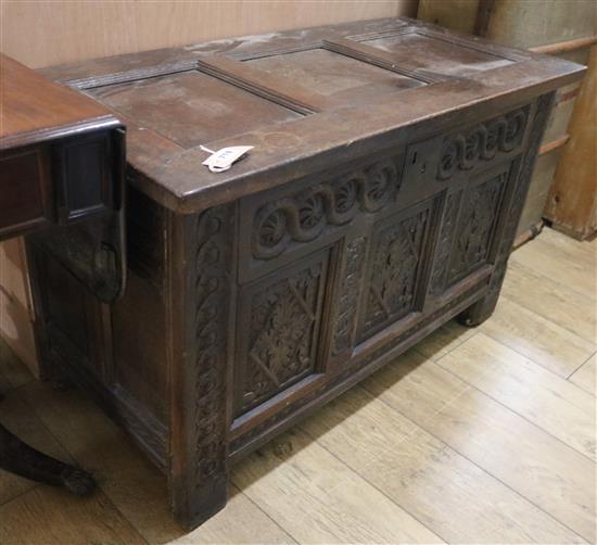 A later carved 17th century oak coffer W.107cm
